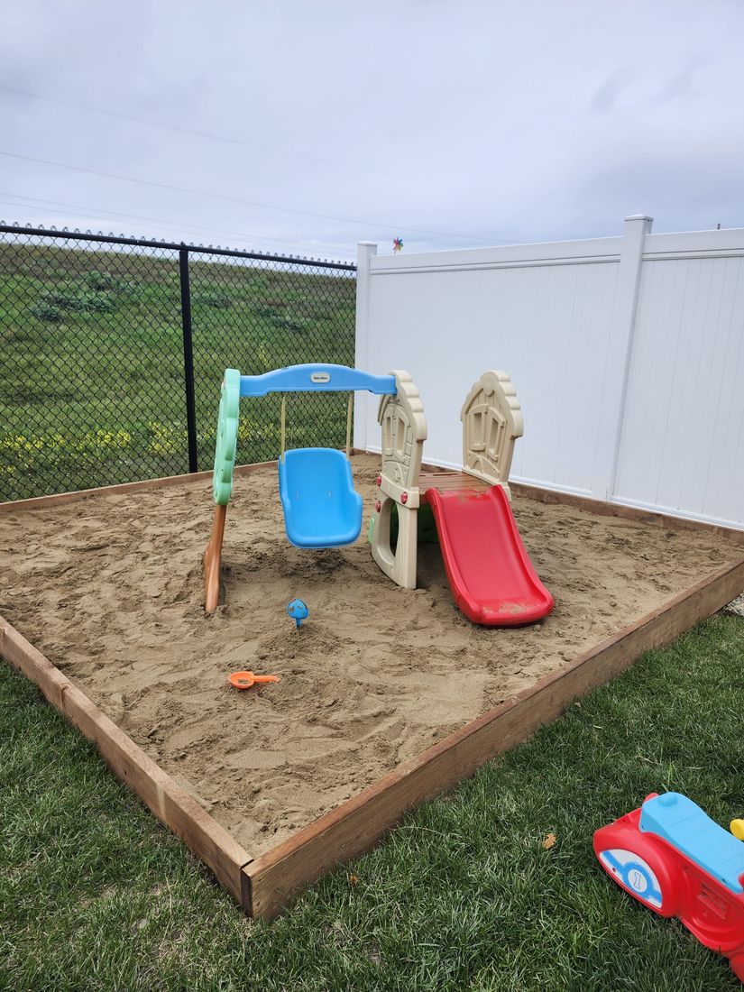 Sandbox with sand toys in the outdoor play area